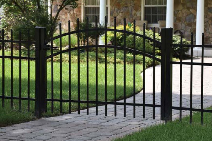 Arched gate entryway with decorative vinyl fencing