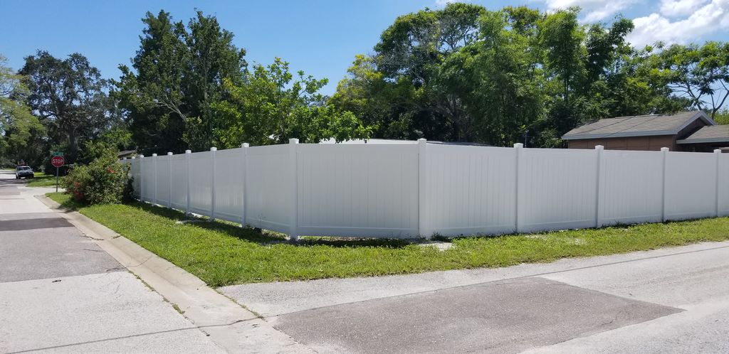 White vinyl fence with trimmed corner detail