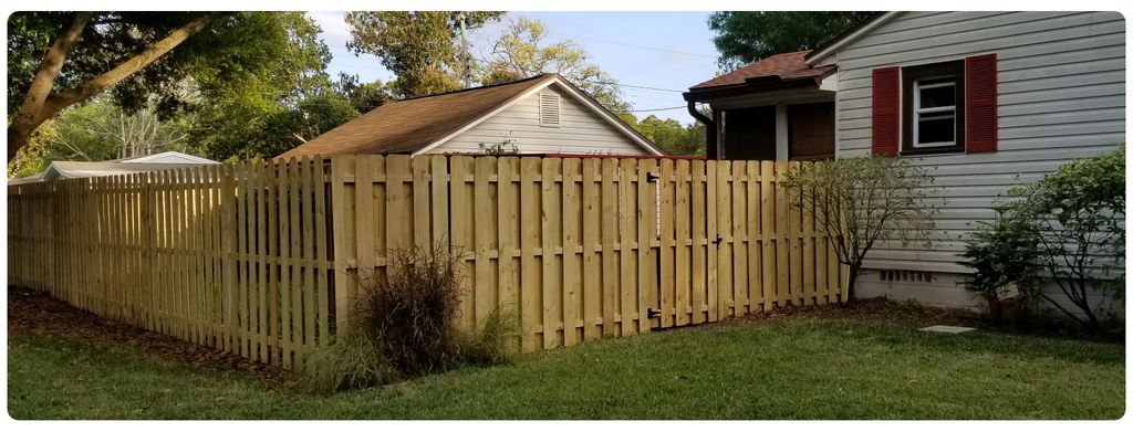 Shadowbox wood privacy fence with alternating boards